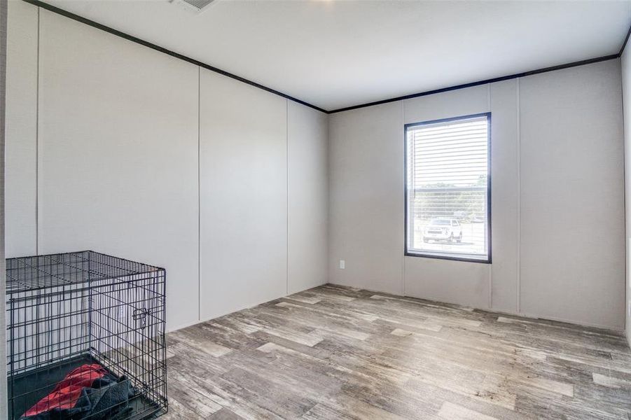 Unfurnished room featuring light wood-type flooring