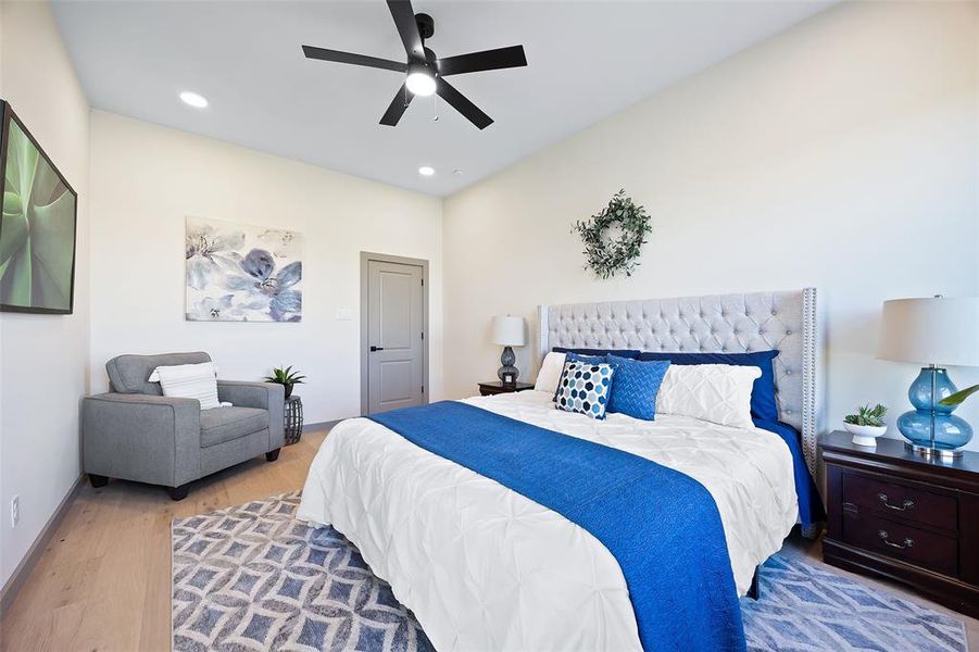 Bedroom with hardwood / wood-style flooring and ceiling fan