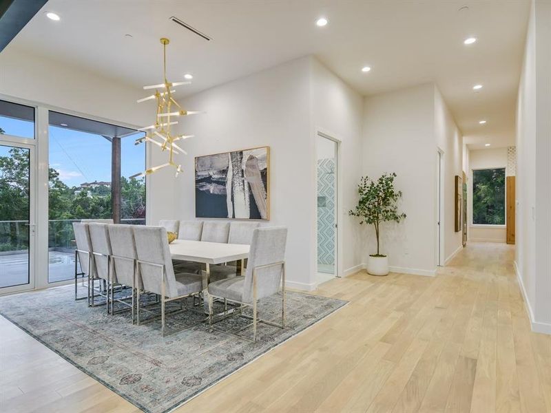 Walk through the massive glass door and intothe 24-foot soaring ceilings in the main entrance into a formal living area.