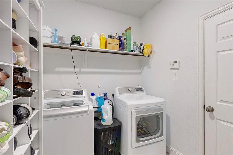 Washroom with washing machine and clothes dryer