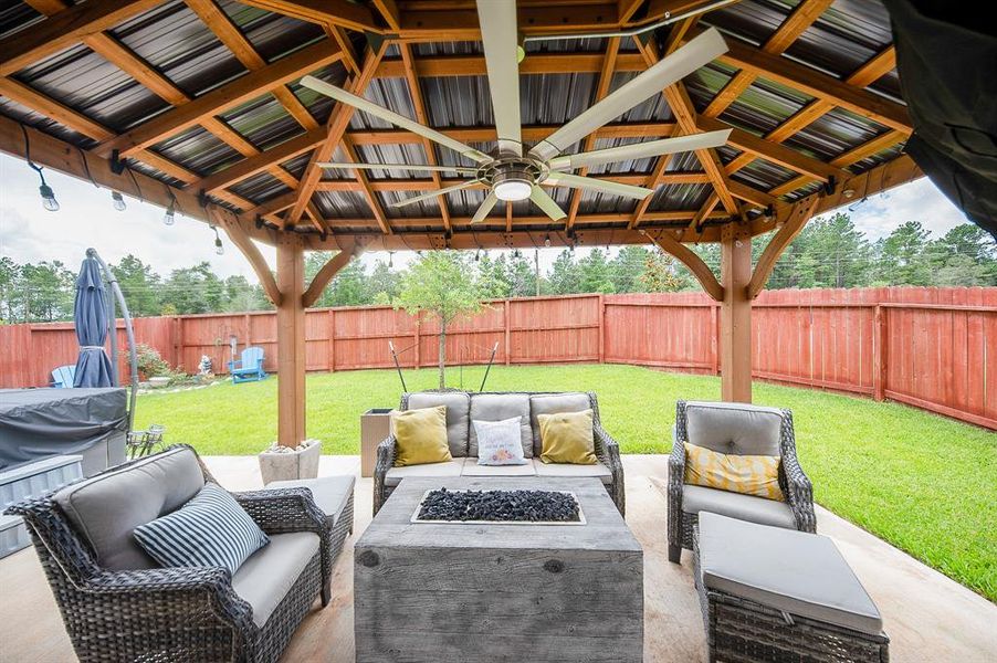 If you love to entertain then this house is for you!  The corner lot means you have no neighbors in the rear or to the east.  Side & back yard is completely fenced. The seller extended the builder grade patio and added this cabana/pergola with large outdoor ceiling fan.  There are also string lights attached, making it a fantastic area for hanging out with family & friends.