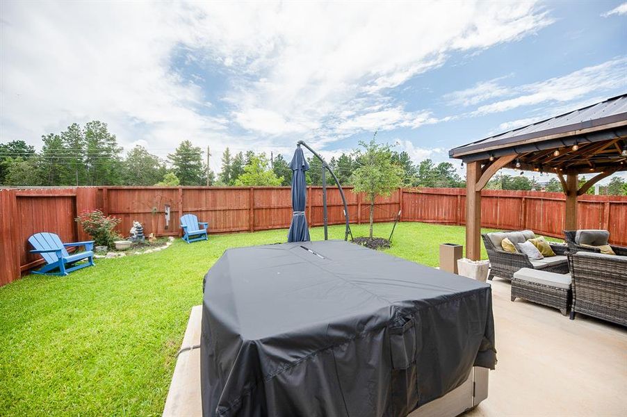 The sellers added this awesome hot tub and it stays with the house!  Brand new & installed last year, this alone was an 18K upgrade to the home.  The sun umbrella shown here also conveys.  You won't find a better home or yard around at this list price!