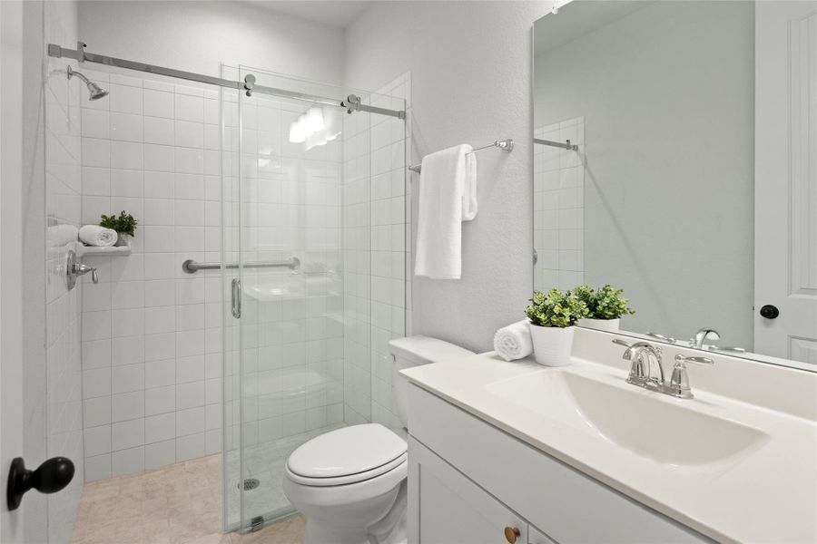 Bedroom 4 has its own private bathroom with walk-in shower