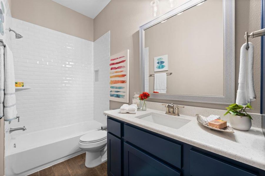 This third bathroom is located in a short hallway behind the kitchen, next to the garage, and laundry room and directly next to the flex-room making this a perfect full pool-bath for guests or a powder bath.