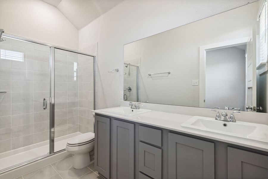 Primary Bathroom in the Ash home plan by Trophy Signature Homes – REPRESENTATIVE PHOTO