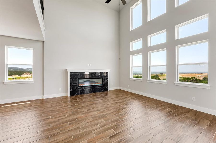 Great lighting and cozy fireplace in the main living room.