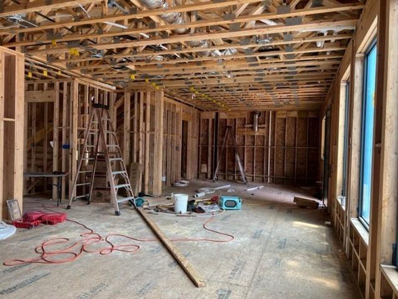 Living area looking towards the kitchen. Open concept. Progress photo taken 4.18.24.