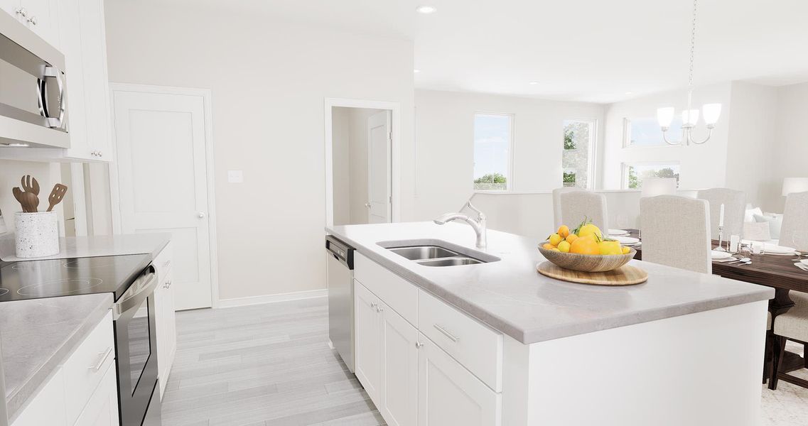 Kitchen with Optional Gray Countertop - Barcelona - Inspired at Prairie Village in Brighton, Colorado by Landsea Homes