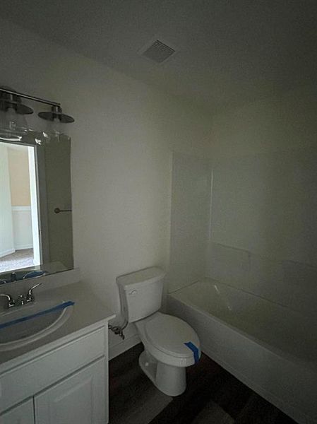 Full bathroom featuring shower / bathing tub combination, toilet, and vanity