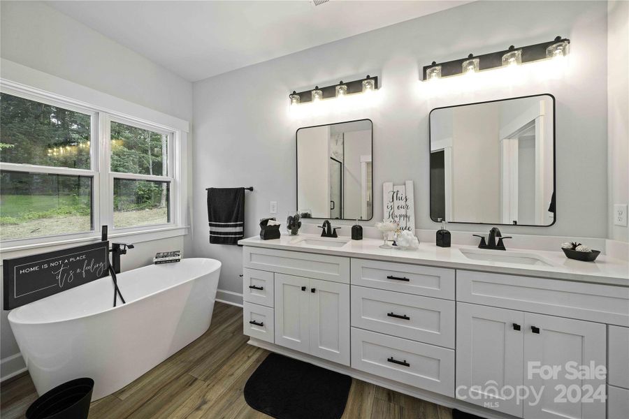 Main Bedroom bath suite with dual vanities & quartz counters.