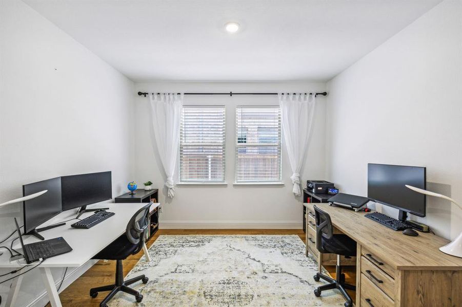 Office space featuring hardwood flooring