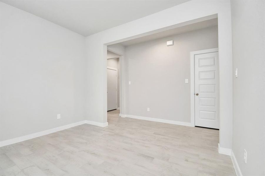 Discover another perspective of the spacious dining room. Sample photo of completed home with similar floor plan. Actual colors and selections may vary.