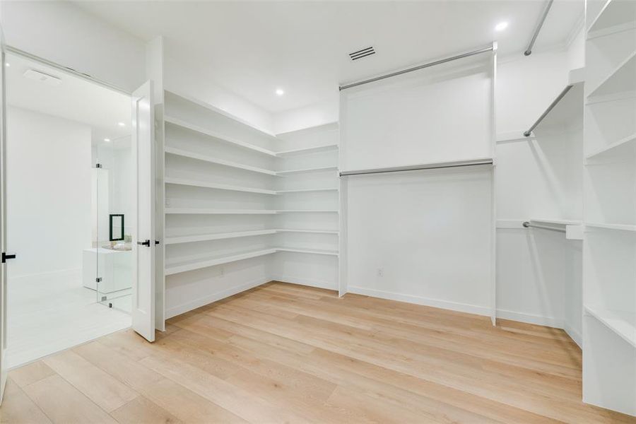 Walk in closet featuring light hardwood / wood-style floors