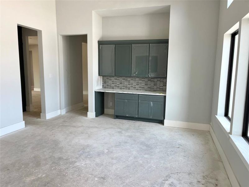 Dining room with butler's pantry, perfect for serving guests or using as a bar.