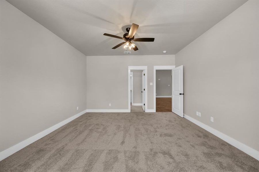 Unfurnished bedroom with carpet and ceiling fan