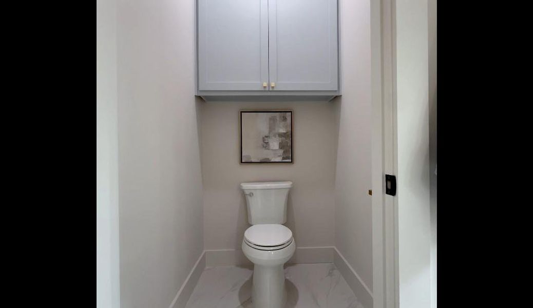Bathroom with tile patterned floors and toilet
