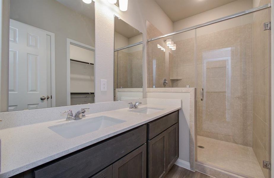 Beautiful primary bath with double vanities & walk in shower