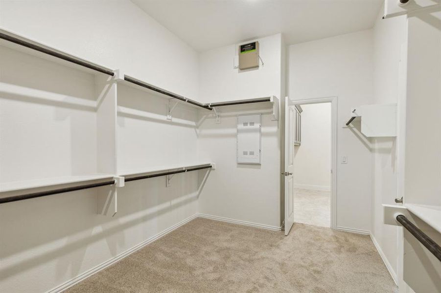 Main closet connected to laundry room