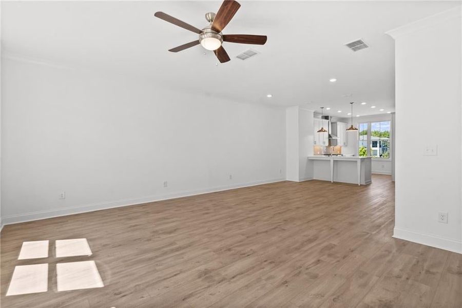 Ceiling fan in the living room and primary bedroom 
Pictures represent a previously built home