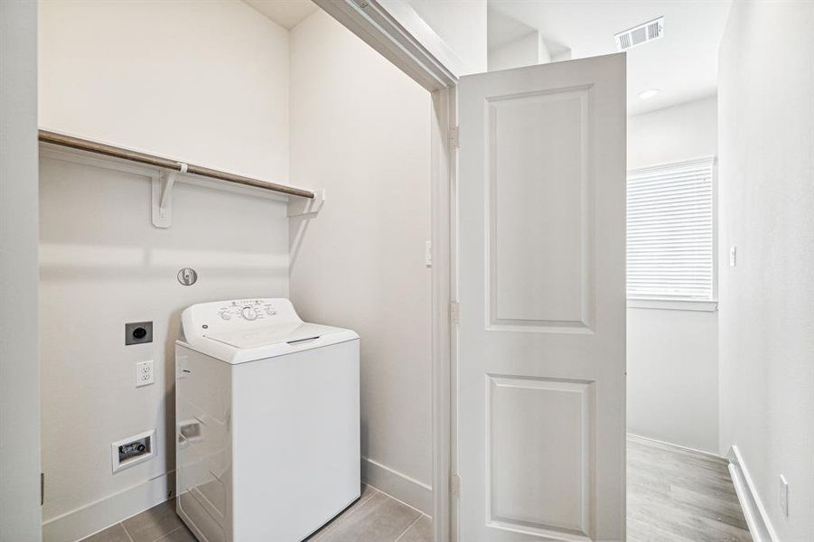 Conveniently located on the secondfloor by the bedroom is the laundryroom that is equipped with gas orelectric dryer connections.