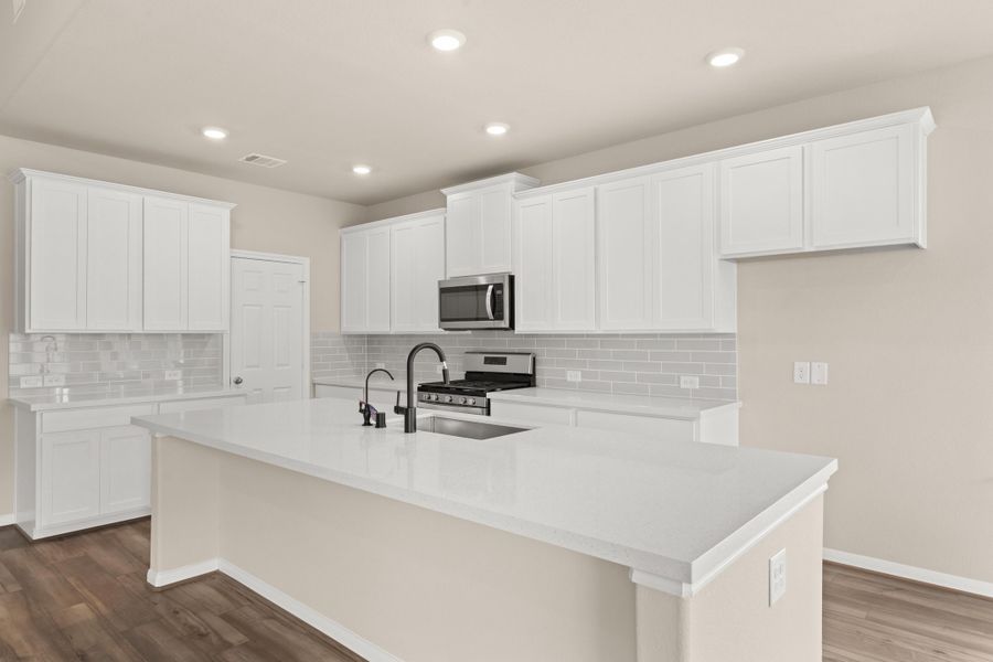 Kitchen. Note: Sample product photo - actual exterior and interior selections may vary by homesite