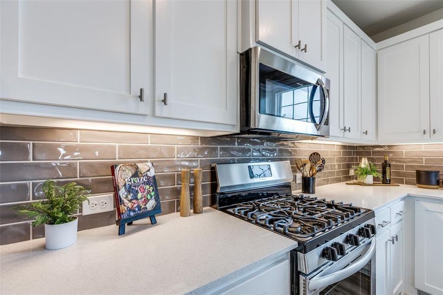 Fantastic prep and storage space is only one of the outstanding features of this beautiful kitchen!