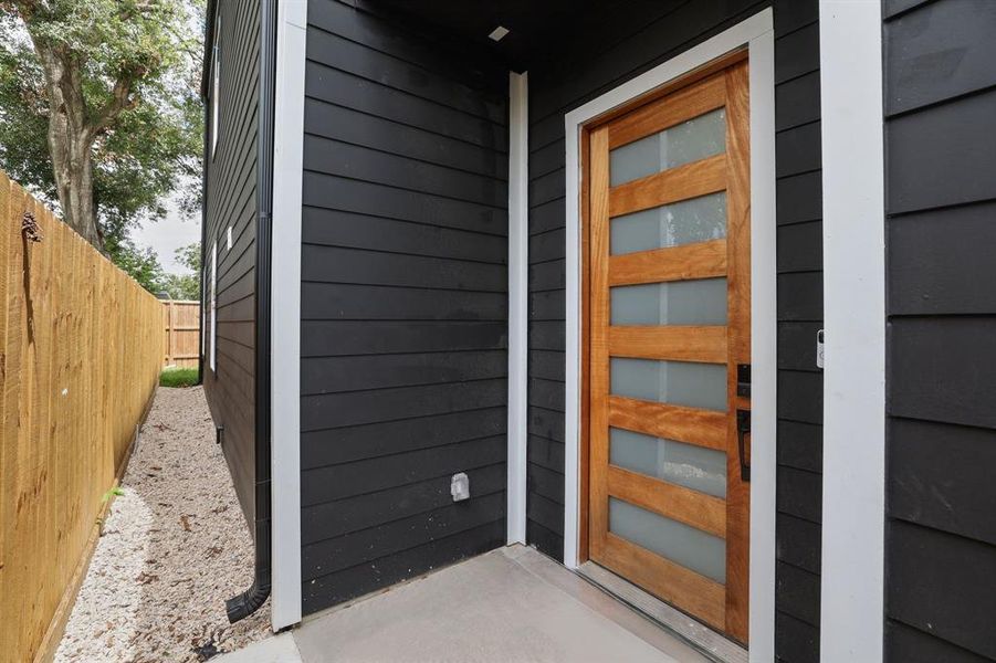 Gated entry way leads into main entryway and offers backyard access.