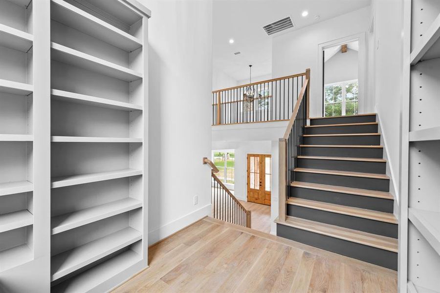 Natural stained wood floor landing and stairs.