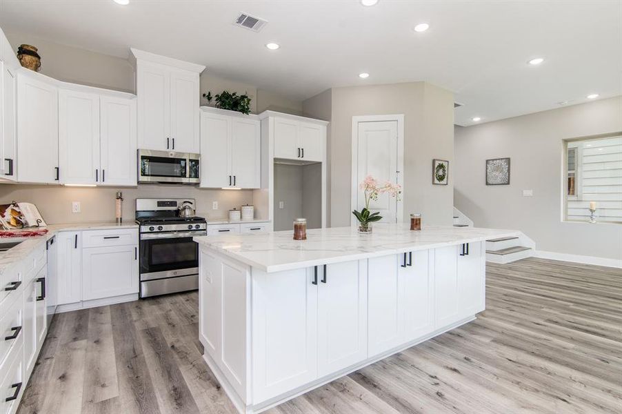 The kitchen is open to the family and dining room.