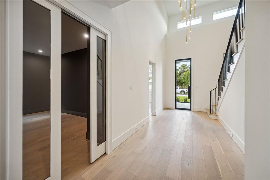 Pocket doors give the study added privacy, for a perfect work from home space. A first floor ensuite guest room with built-in desk is just off the gallery foyer.