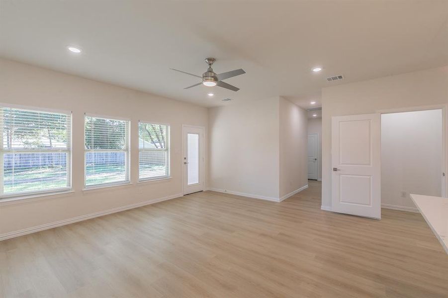 Unfurnished room featuring ceiling fan and light hardwood / wood-style floors