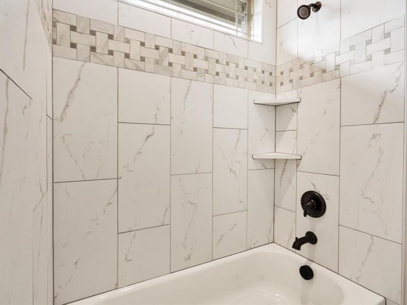 Bathroom featuring tiled shower / bath