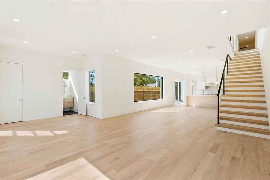 Unfurnished living room featuring light wood-type flooring