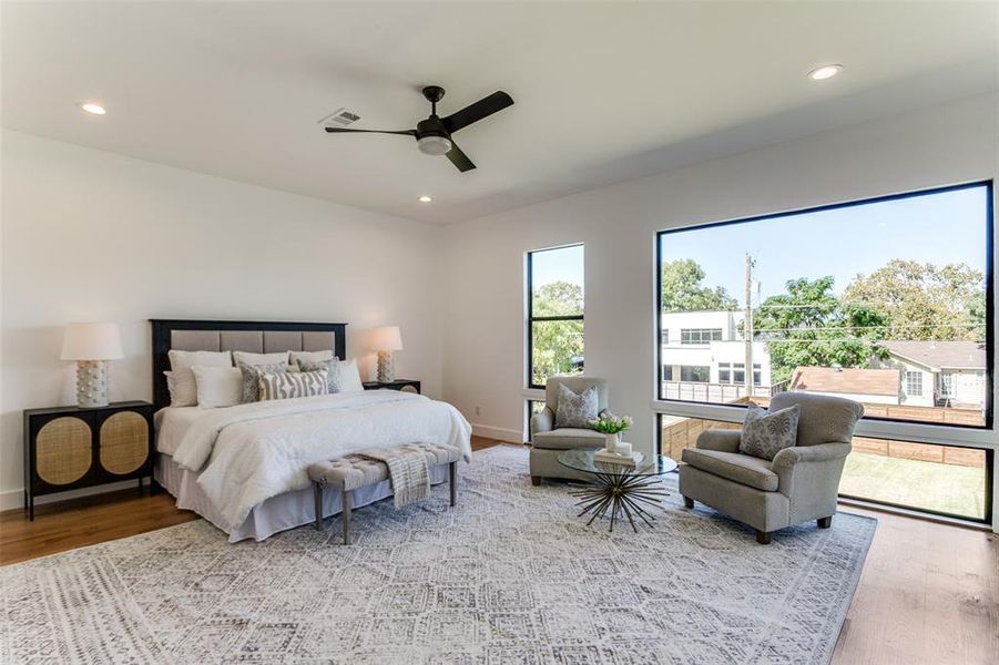 Bedroom featuring light hardwood / wood-style floors and ceiling fan