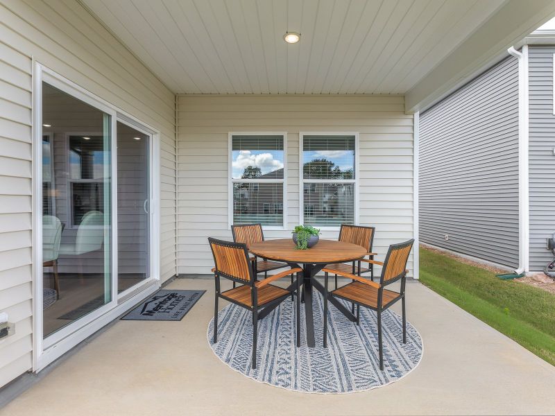 Covered rear patio in the Chandler floorplan at a Meritage Homes community in Angier, NC.