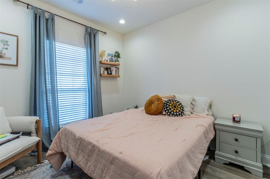 Bedroom featuring wood-style flooring