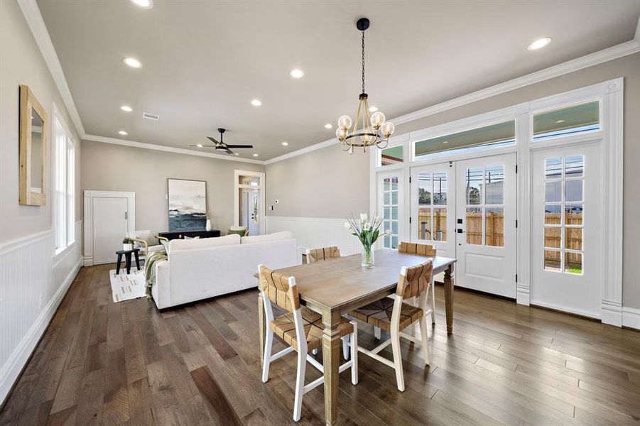 French doors lead out to the side yard (possible pool!) from the Dining area. Plenty of natural light through the doors, sidelights and transom windows!