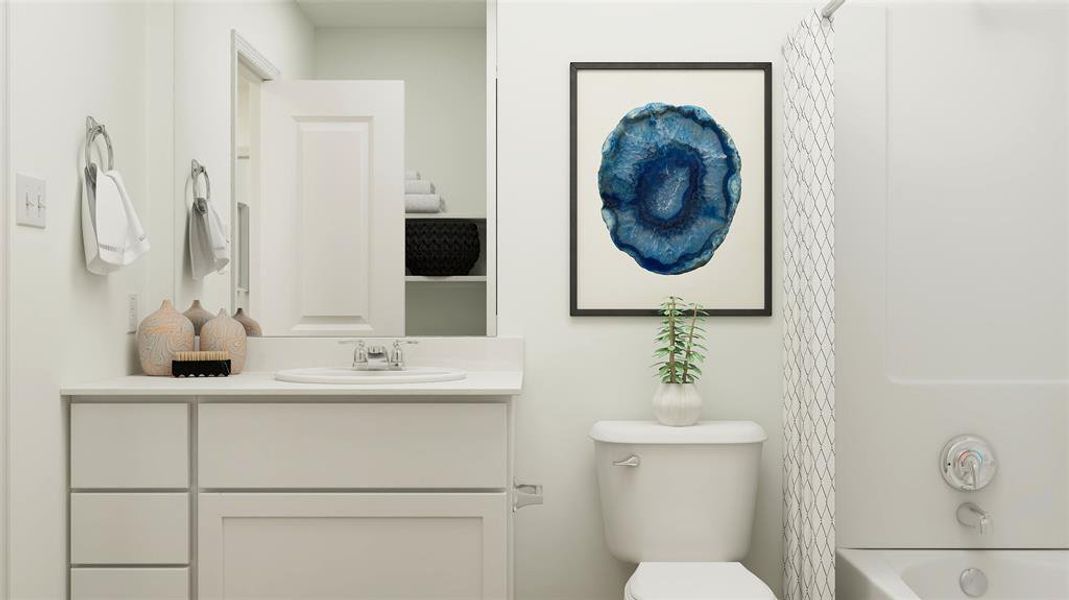 Full bathroom featuring vanity, toilet, and shower / tub combo with curtain