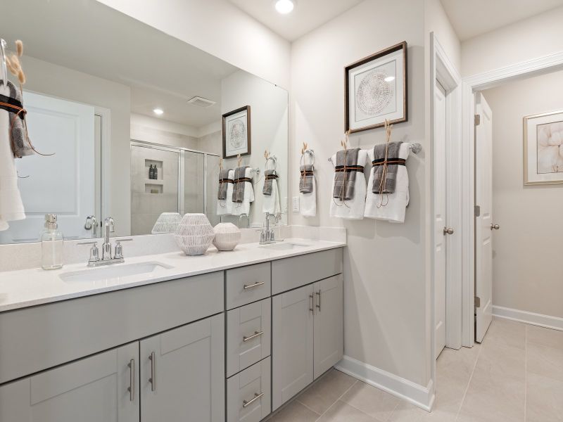 The primary suite boasts a private ensuite with dual sinks and generous walk-in closet.