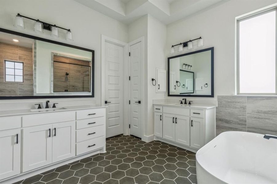 Bathroom with vanity, tile walls, a healthy amount of sunlight, and shower with separate bathtub