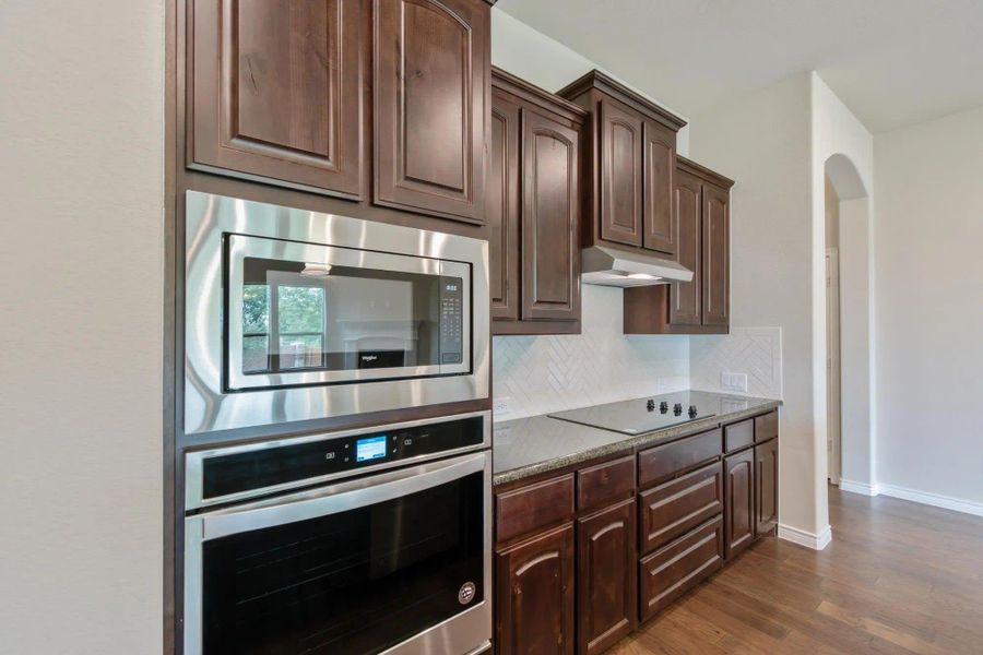 Kitchen | Concept 2671 at Oak Hills in Burleson, TX by Landsea Homes