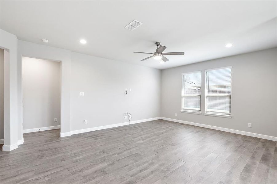 Spare room featuring light hardwood / wood-style flooring and ceiling fan