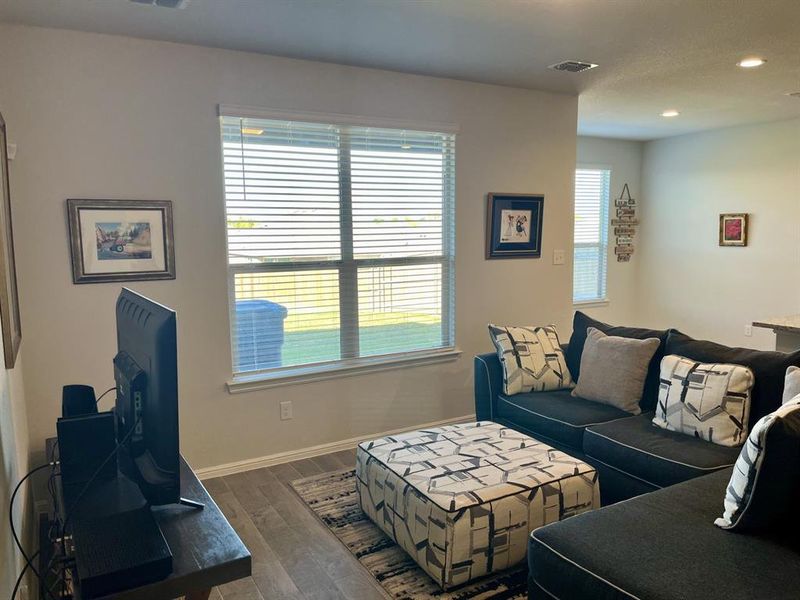 Living room featuring dark hardwood / wood-style flooring