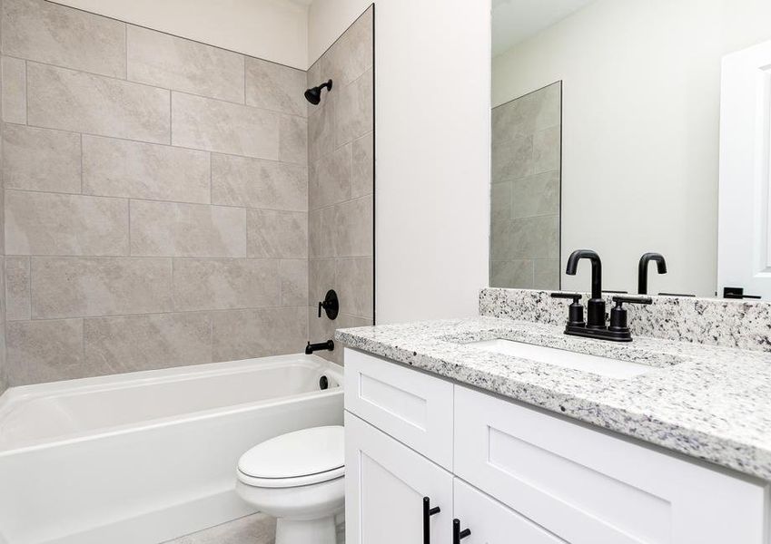 The secondary bathroom offers plenty of space for your guests to get ready