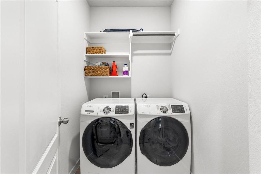 Laundry room with washing machine and dryer