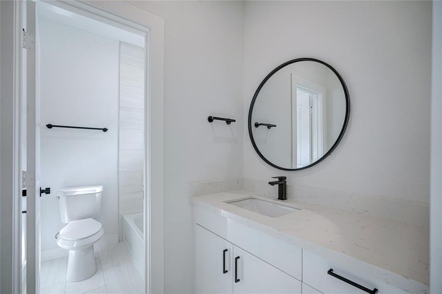 The secondary bathrooms have a separate sinks with the shared tub