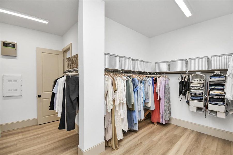 Generous walk in closet features built-in shelving for ample storage and organization.  The closet connects to the mud/laundry room, convenient for handling laundry without leaving the suite.