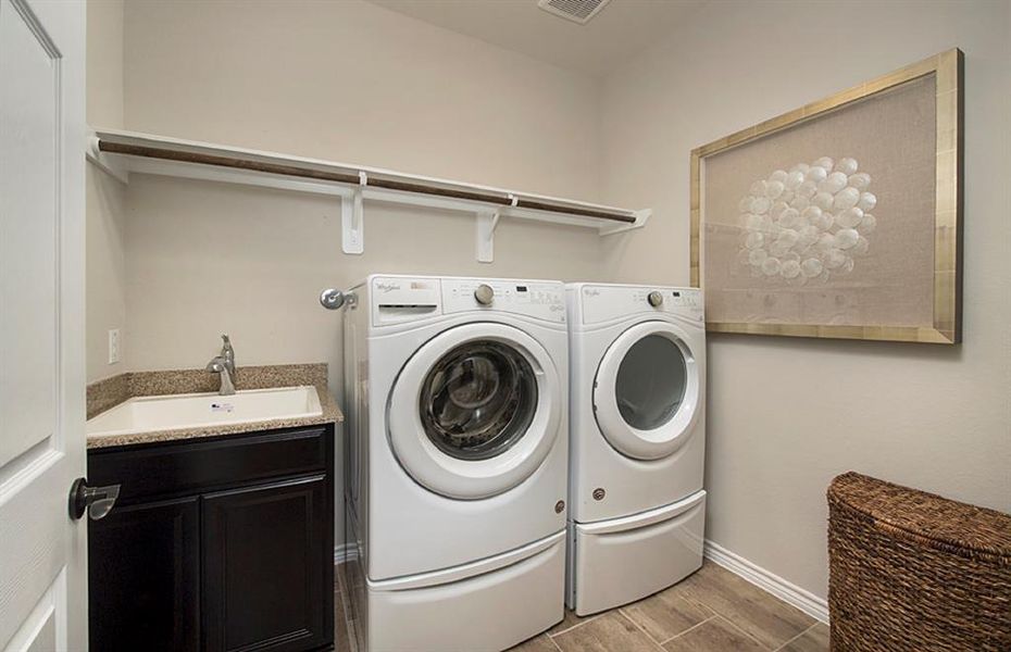 Spacious laundry room  *Photos of furnished model. Not actual home. Representative of floor plan. Some options and features may vary