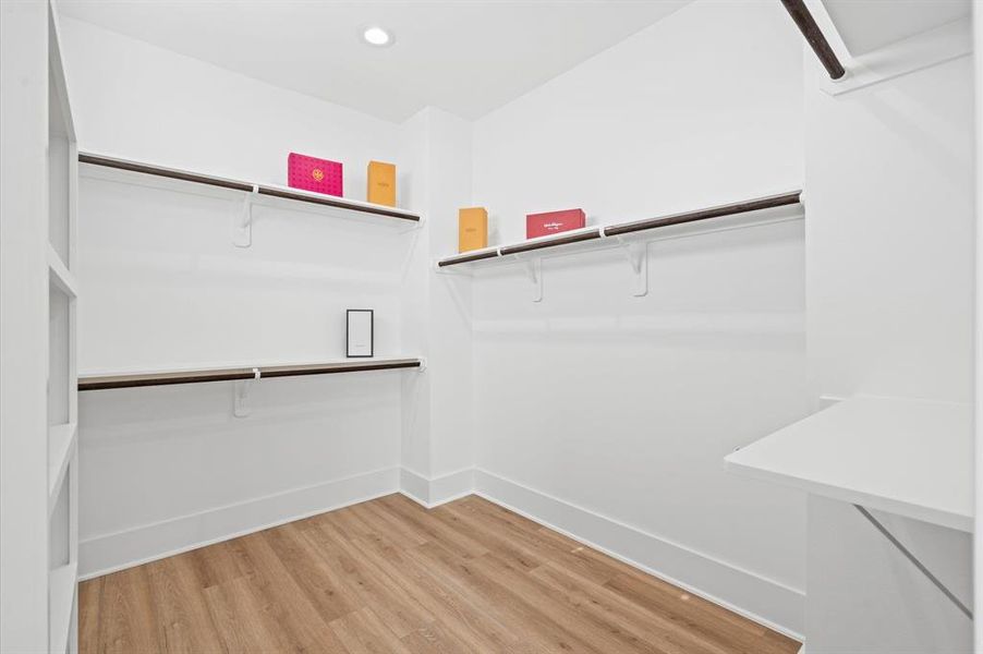 Organization will be a breeze in the primary closet which features multi-level rods and built-ins meticulously designed to optimize storage space.  *All interior photos are from the model home: 5216 Pine Tree*