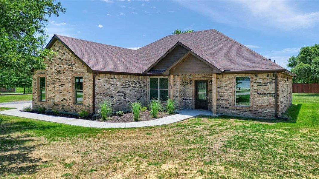 View of front of property with a front yard